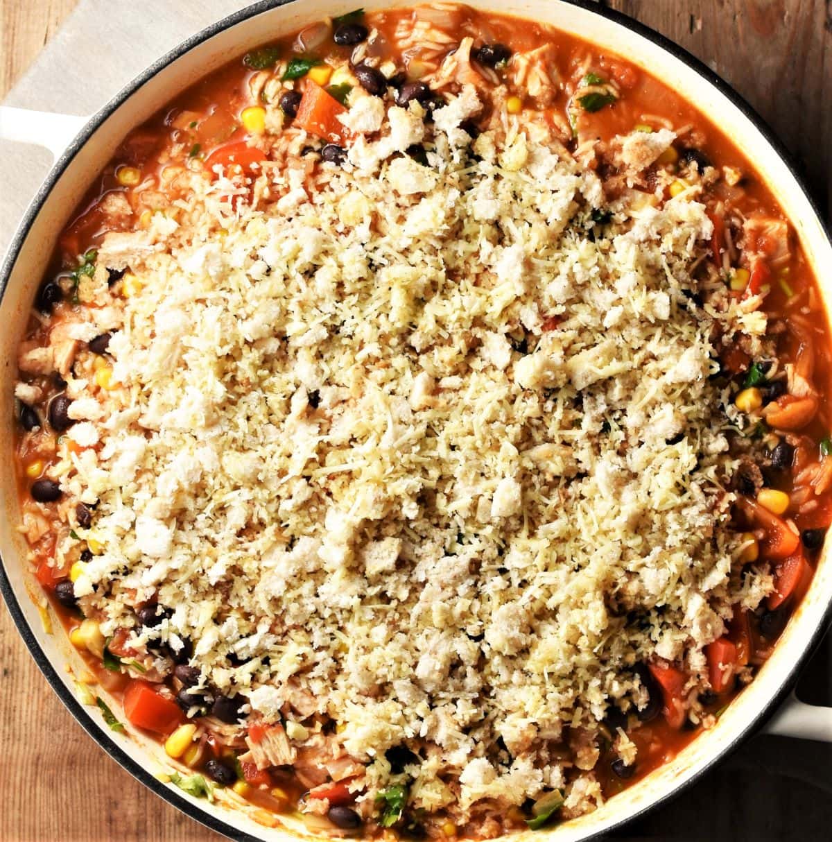 Rice turkey casserole with fresh bread topping in round pan.