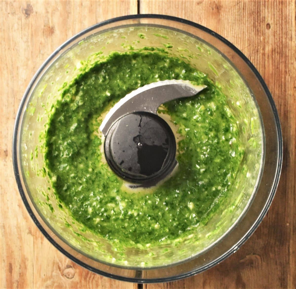 Fresh herb sauce in small blender.