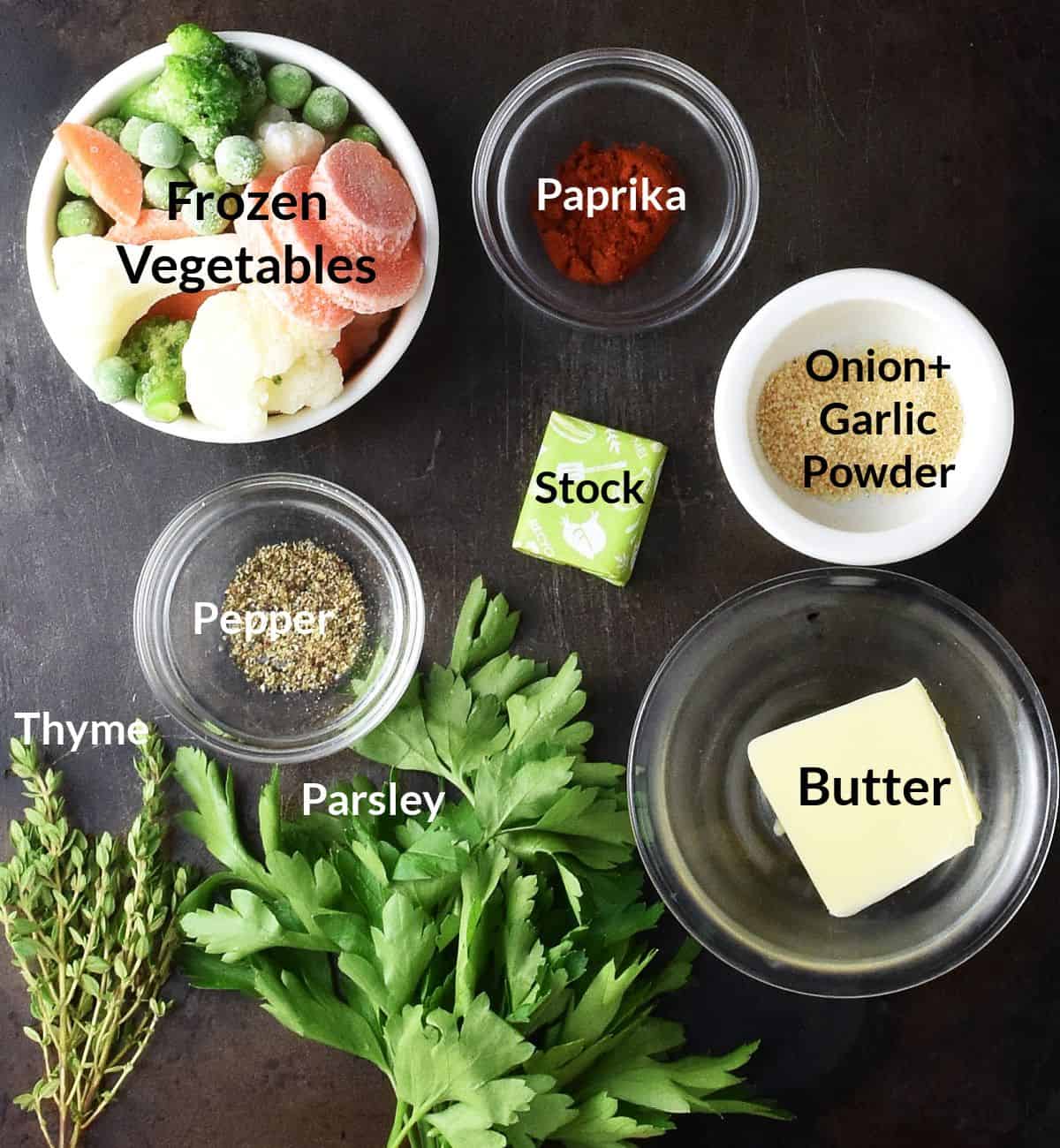 Top down view of ingredients for frozen vegetable soup in individual dishes.