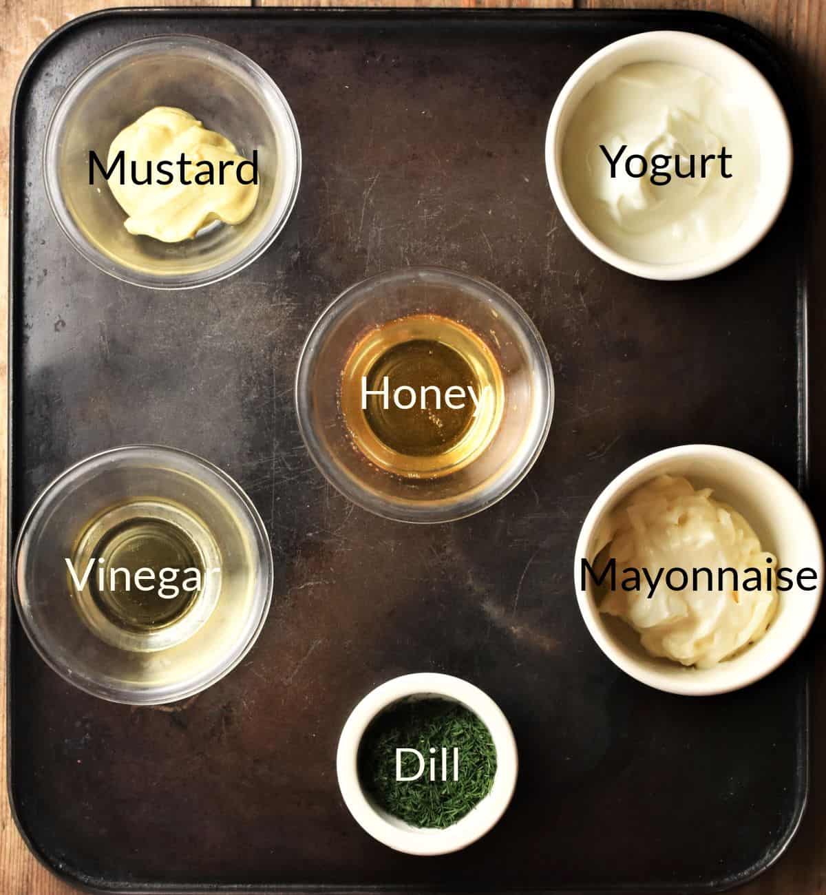 Ingredients for making dill, mustard and honey sauce in individual dishes.