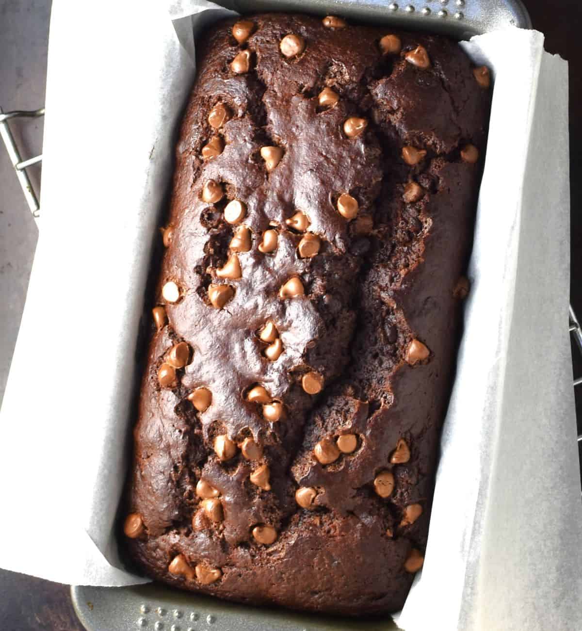 Top down view of chocolate and banana cake in pan.