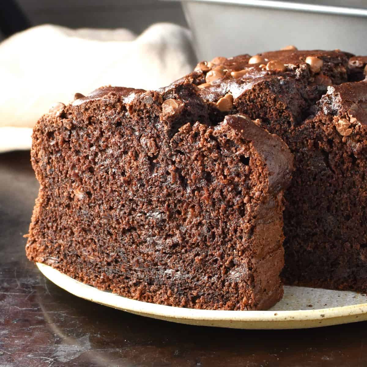 Side view of healthy chocolate banana cake on top of plate.
