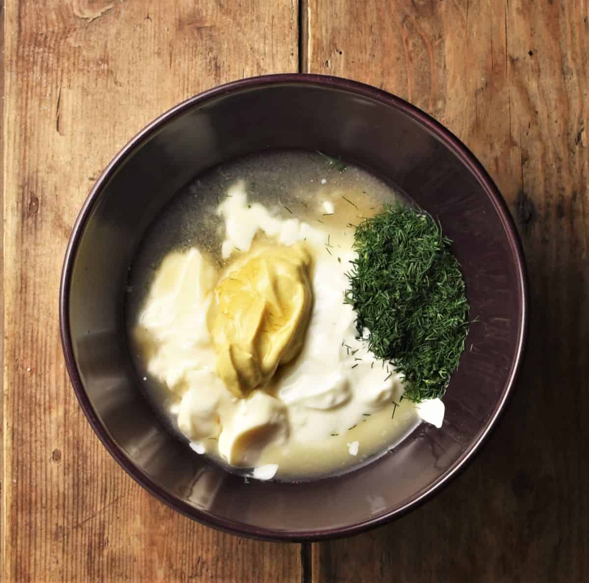 Ingredients for dill and mustard sauce in purple bowl.