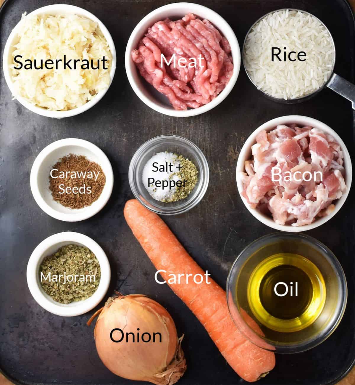 Top down view of ingredients for making sauerkraut cabbage rolls filling in individual dishes.