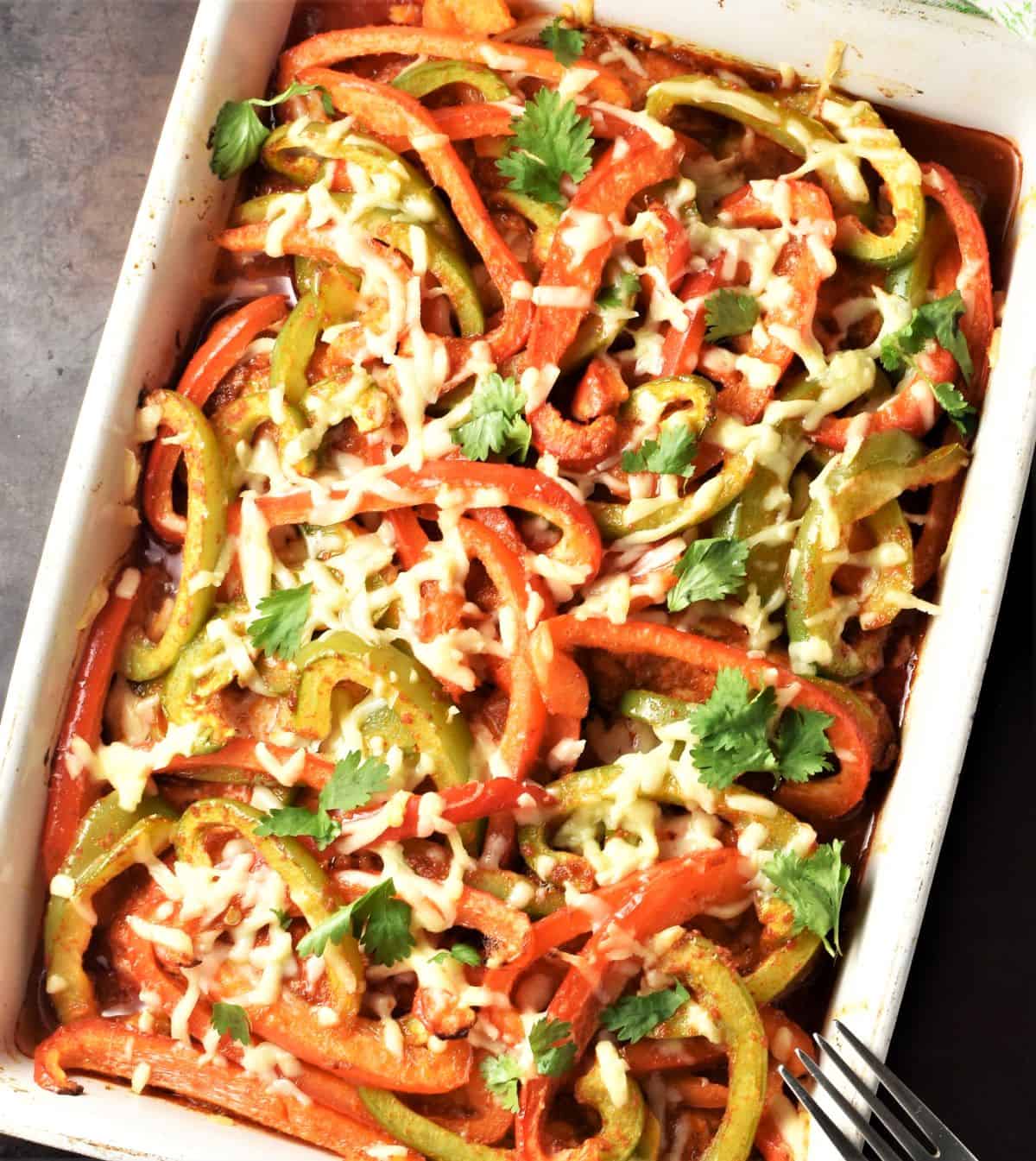 Top down view of chicken fajitas casserole with peppers.