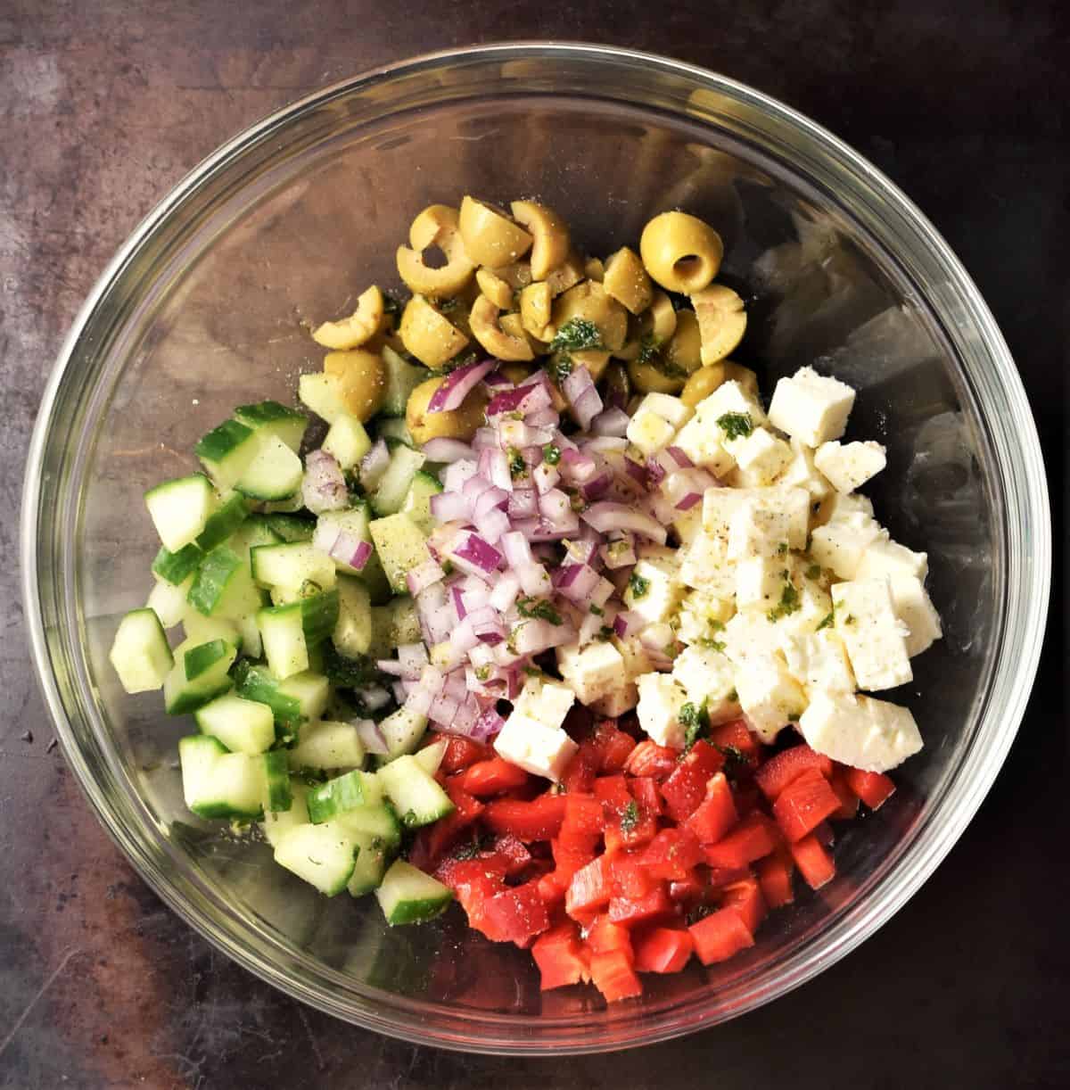 Ingredients for stuffing tomatoes in mixing bowl.
