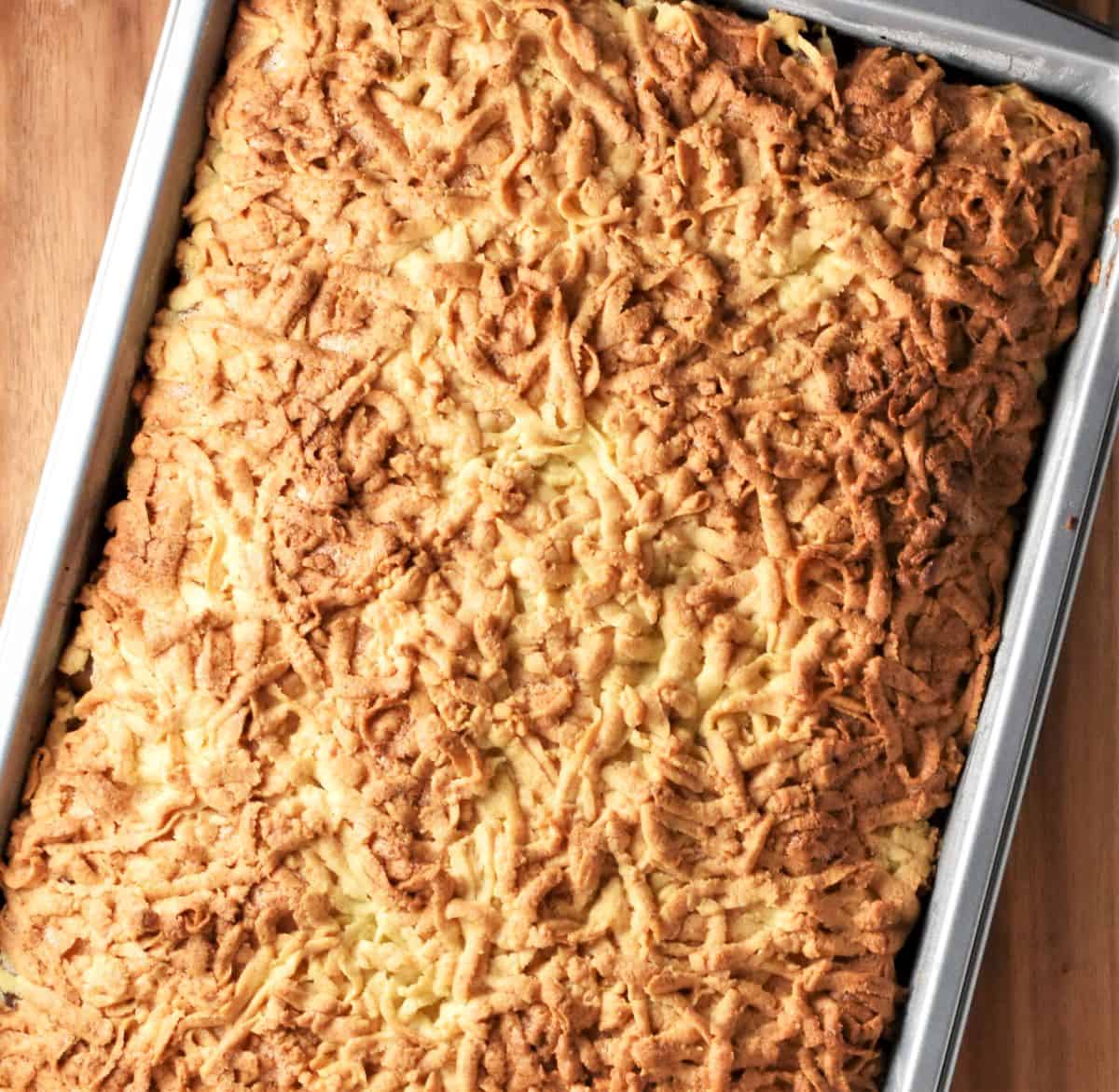 Apple crumble cake in rectangular pan.