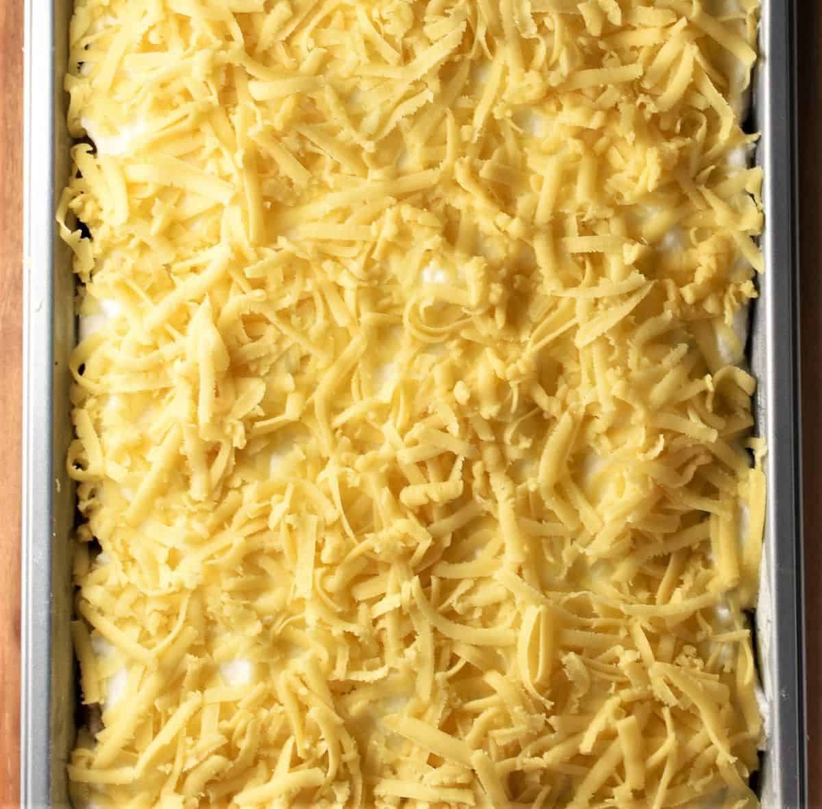 Unbaked crumble cake in pan.