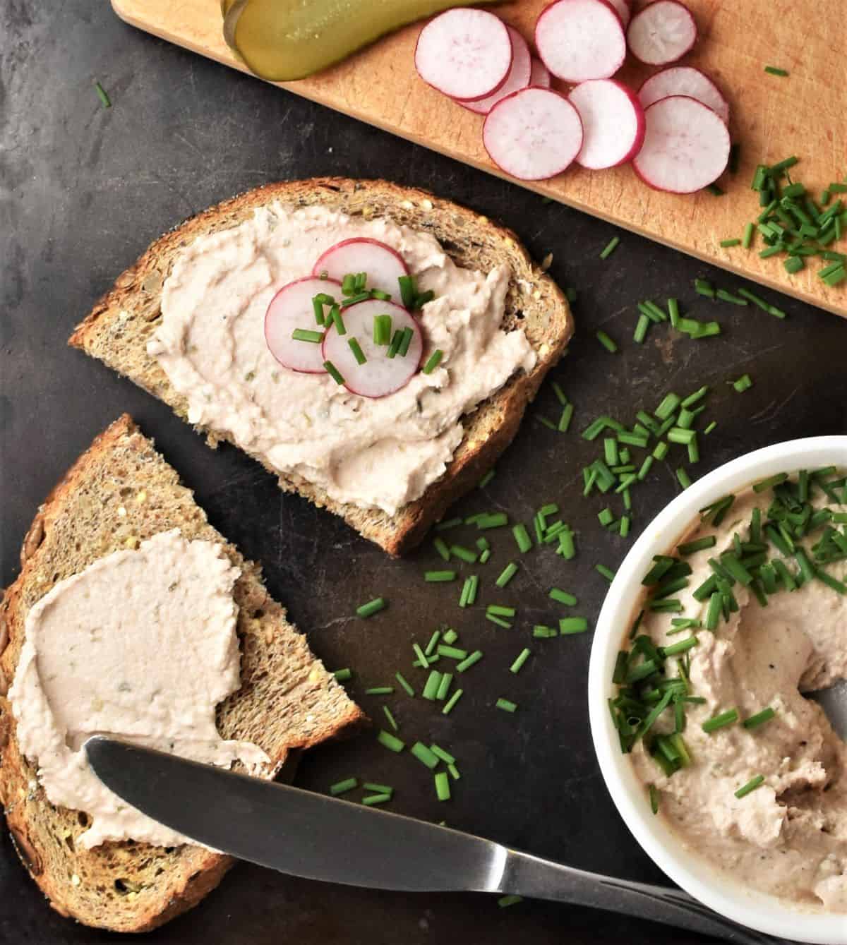 Top down view of tuna spread on bread and in bowl.