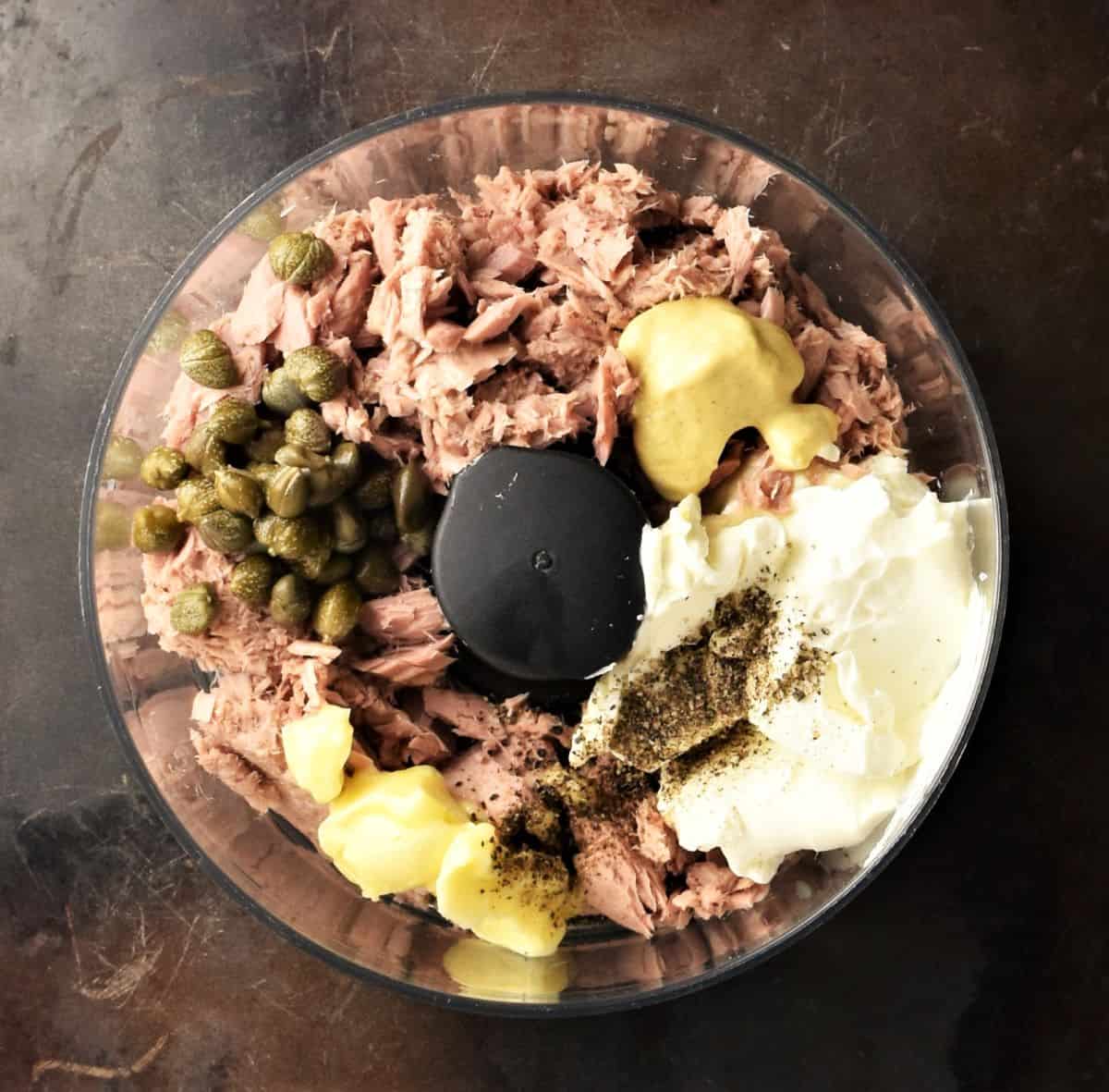 Top down view of tuna pate ingredients in food processor bowl.