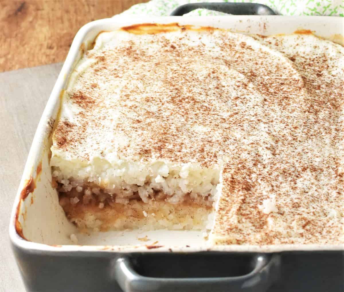 Side view of rice and apples bake in rectangular dish.