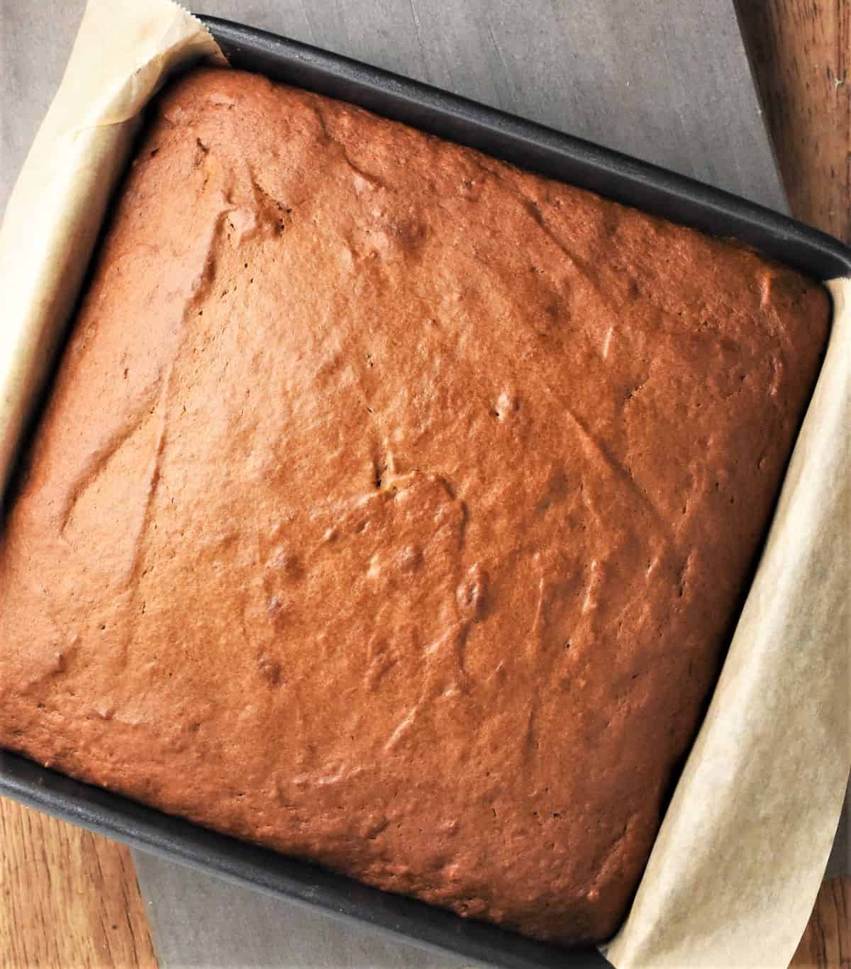 Baked pumpkin cake in square pan.