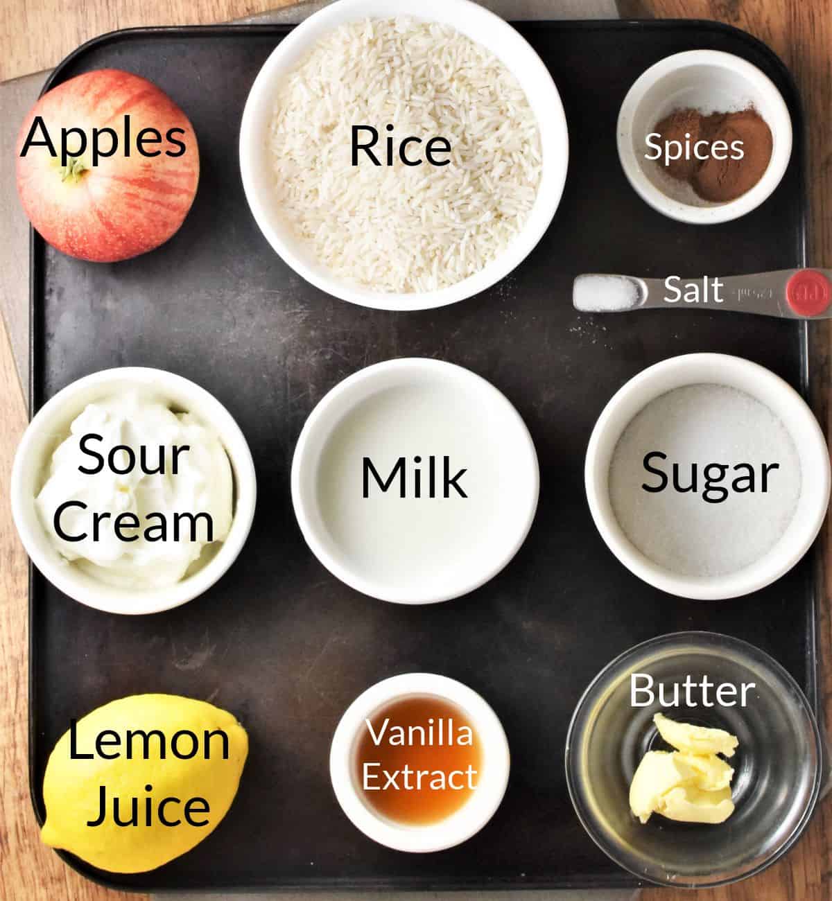 Ingredients for making Polish rice with apples in individual dishes.