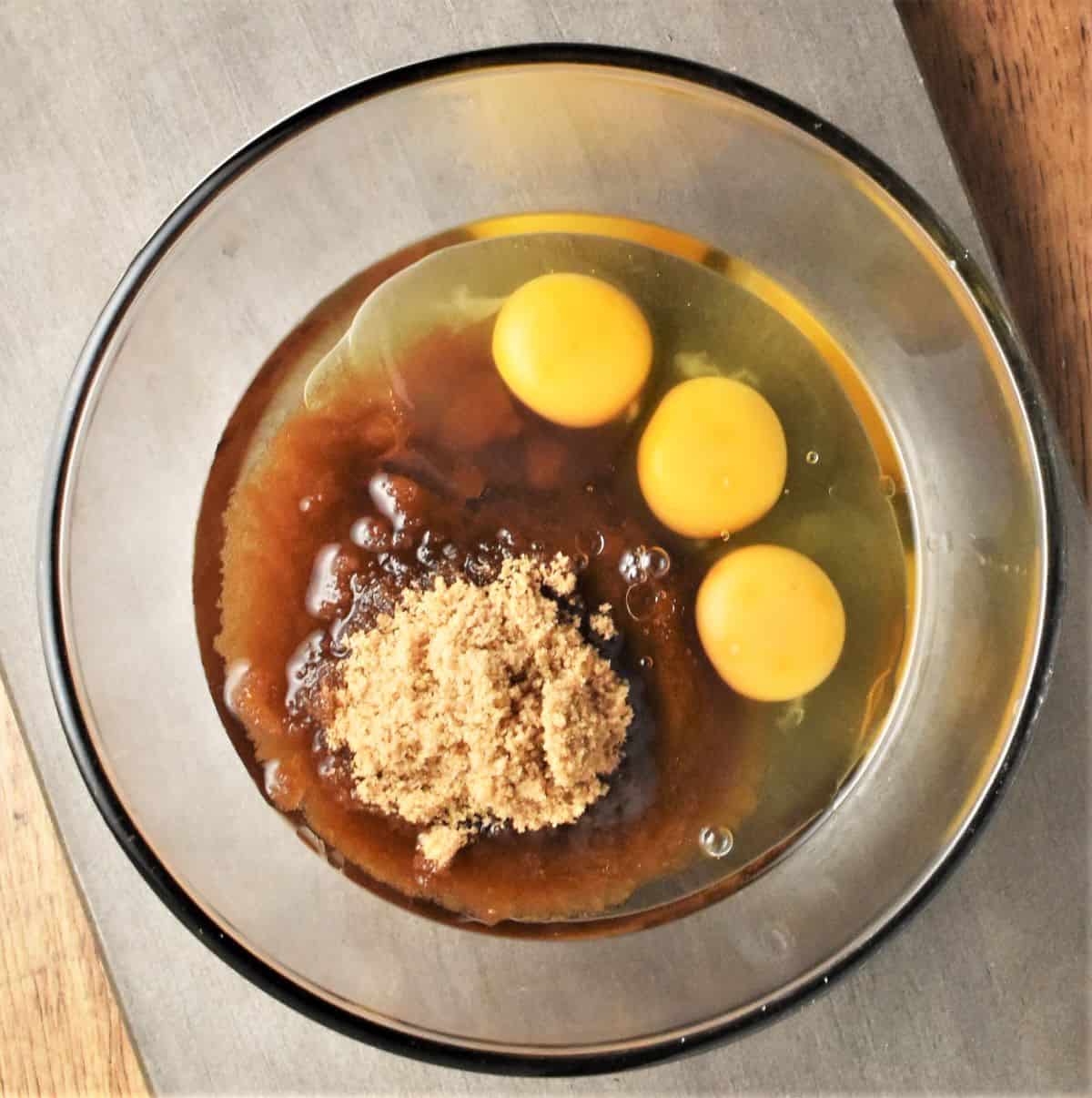 Eggs, sugar and oil in bowl.