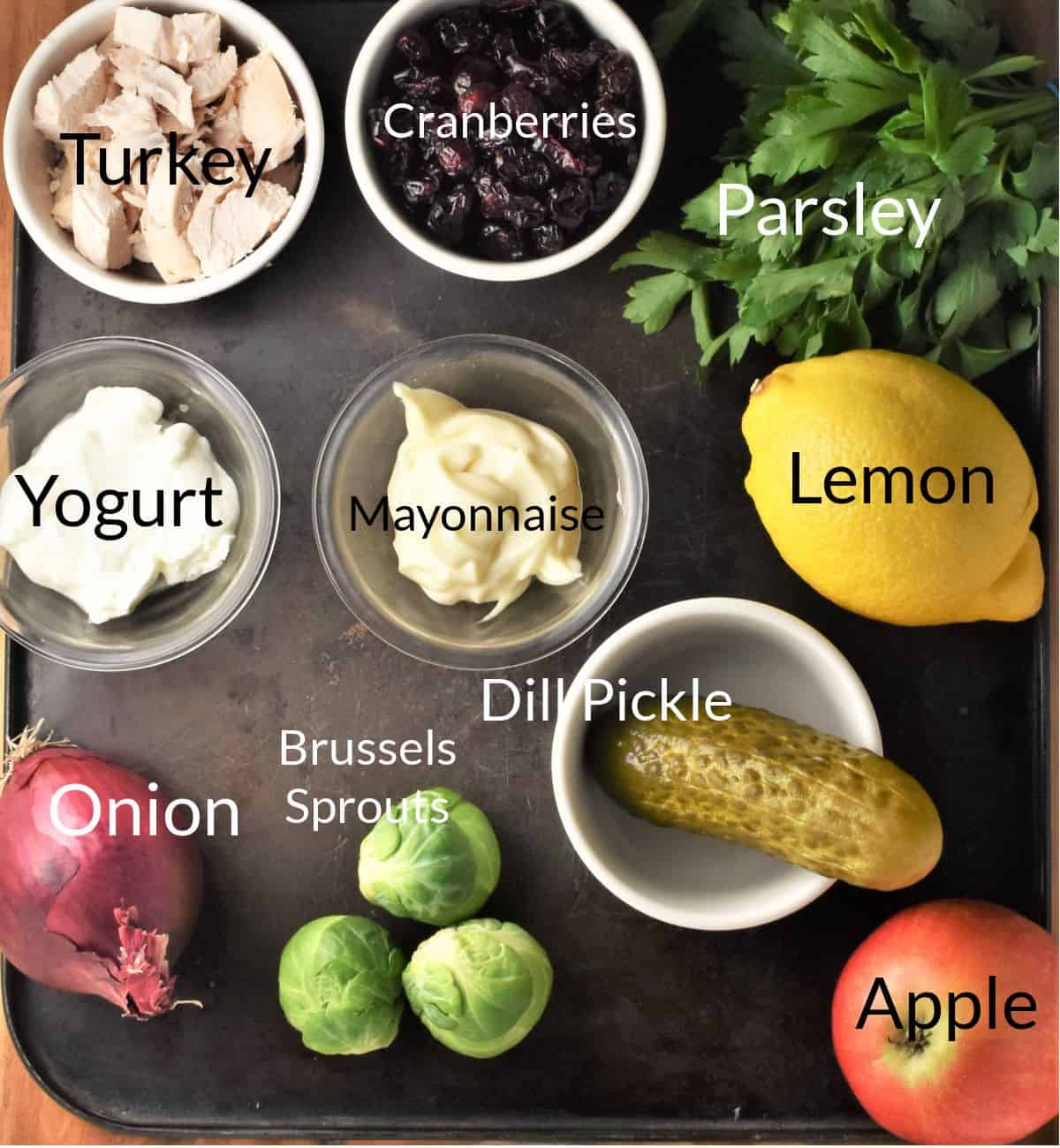 Ingredients for making leftover turkey cranberry salad in individual dishes.