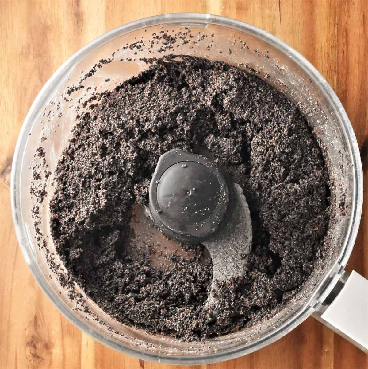 Blending poppy seeds in food processor.