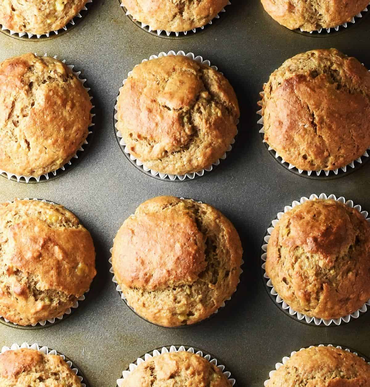 Top down view of baked banana and peanut butter muffins in pan.