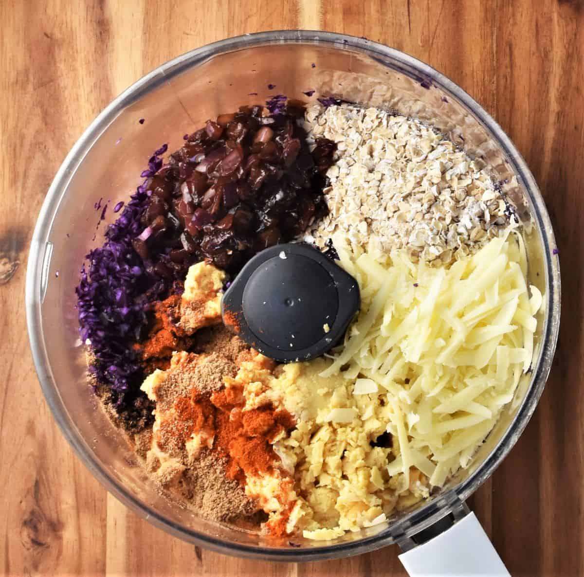 Chopped ingredients for patties in blender bowl.