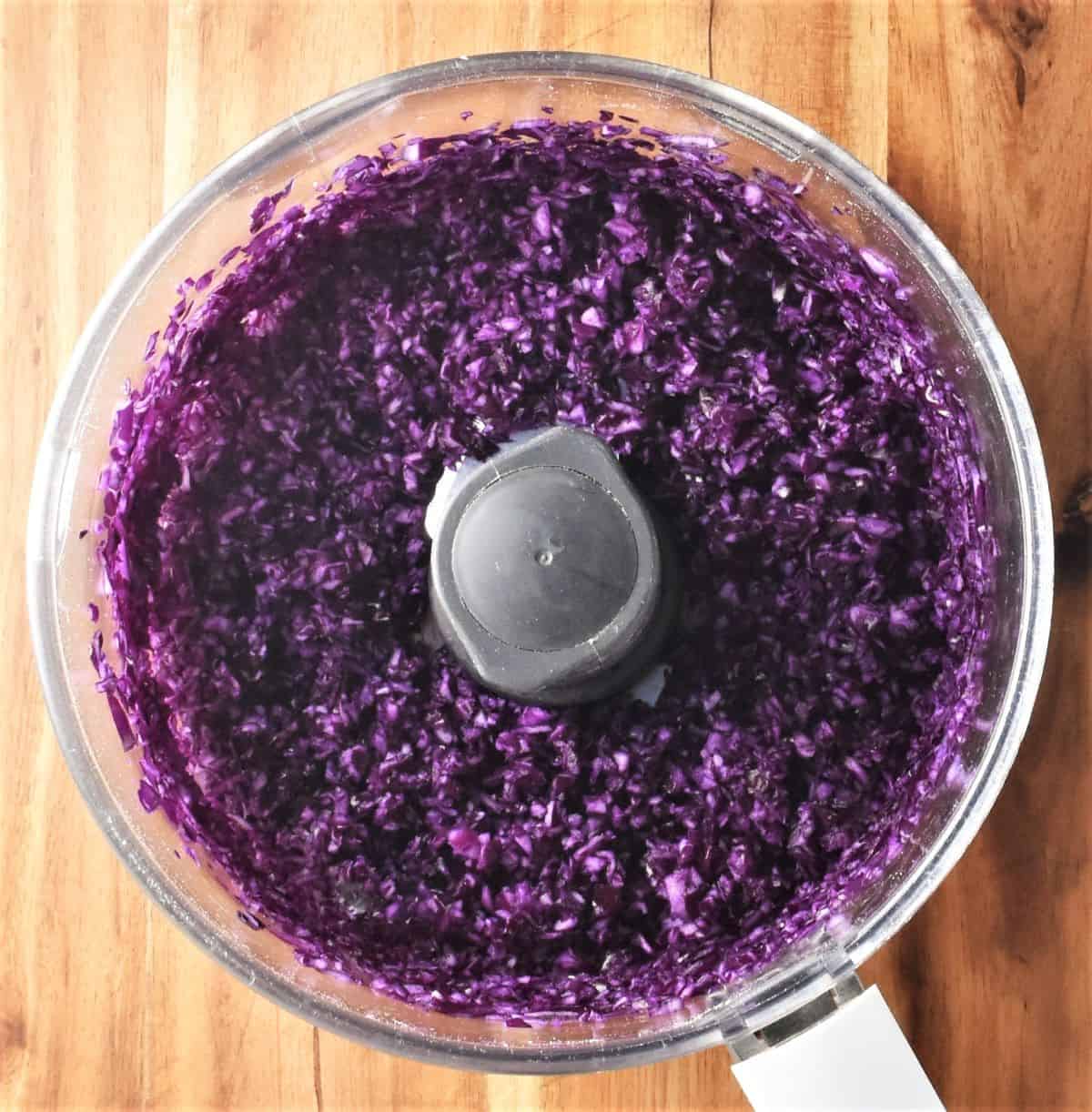 Finely chopped red cabbage in blender bowl.