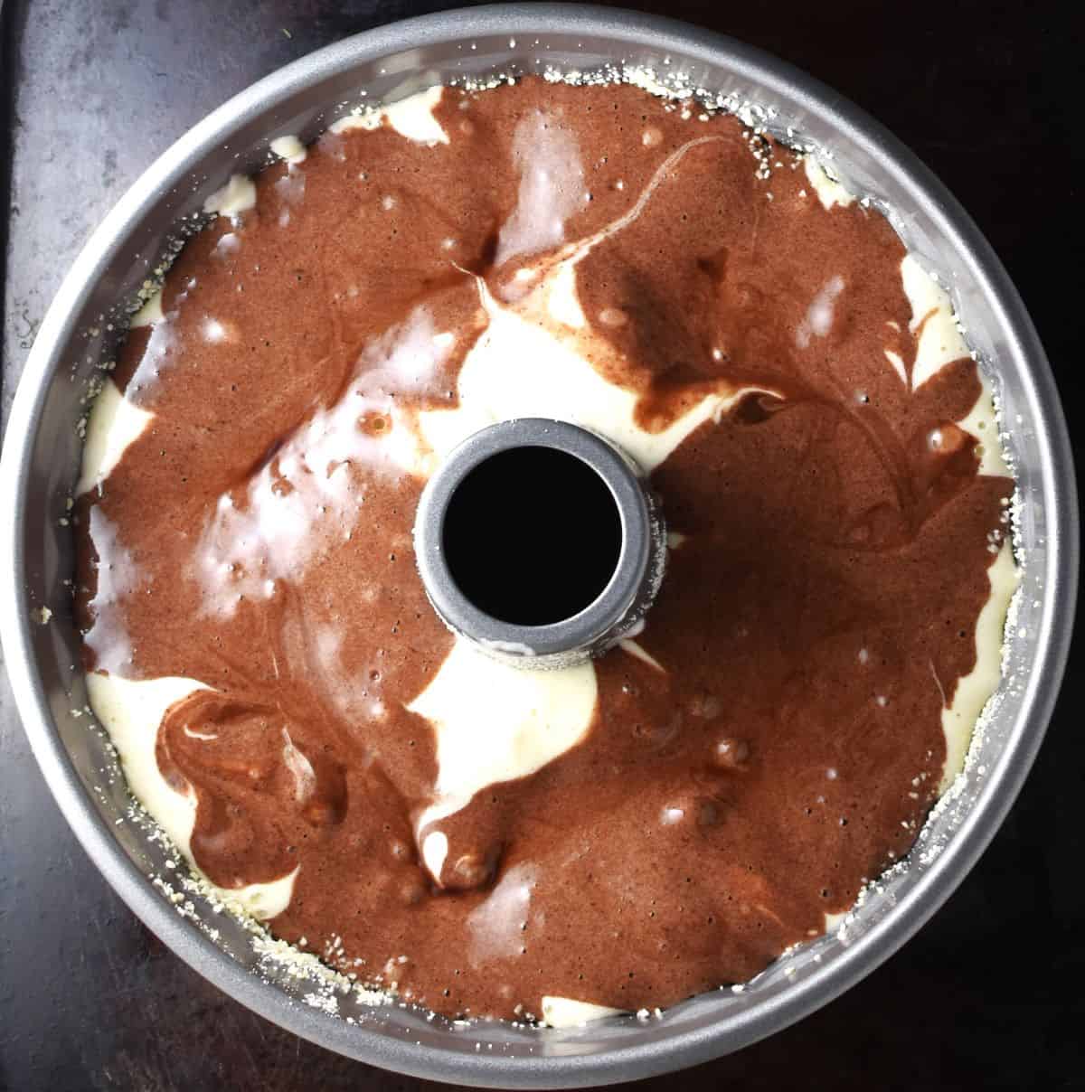 Top down view of babka cake batter in round pan.