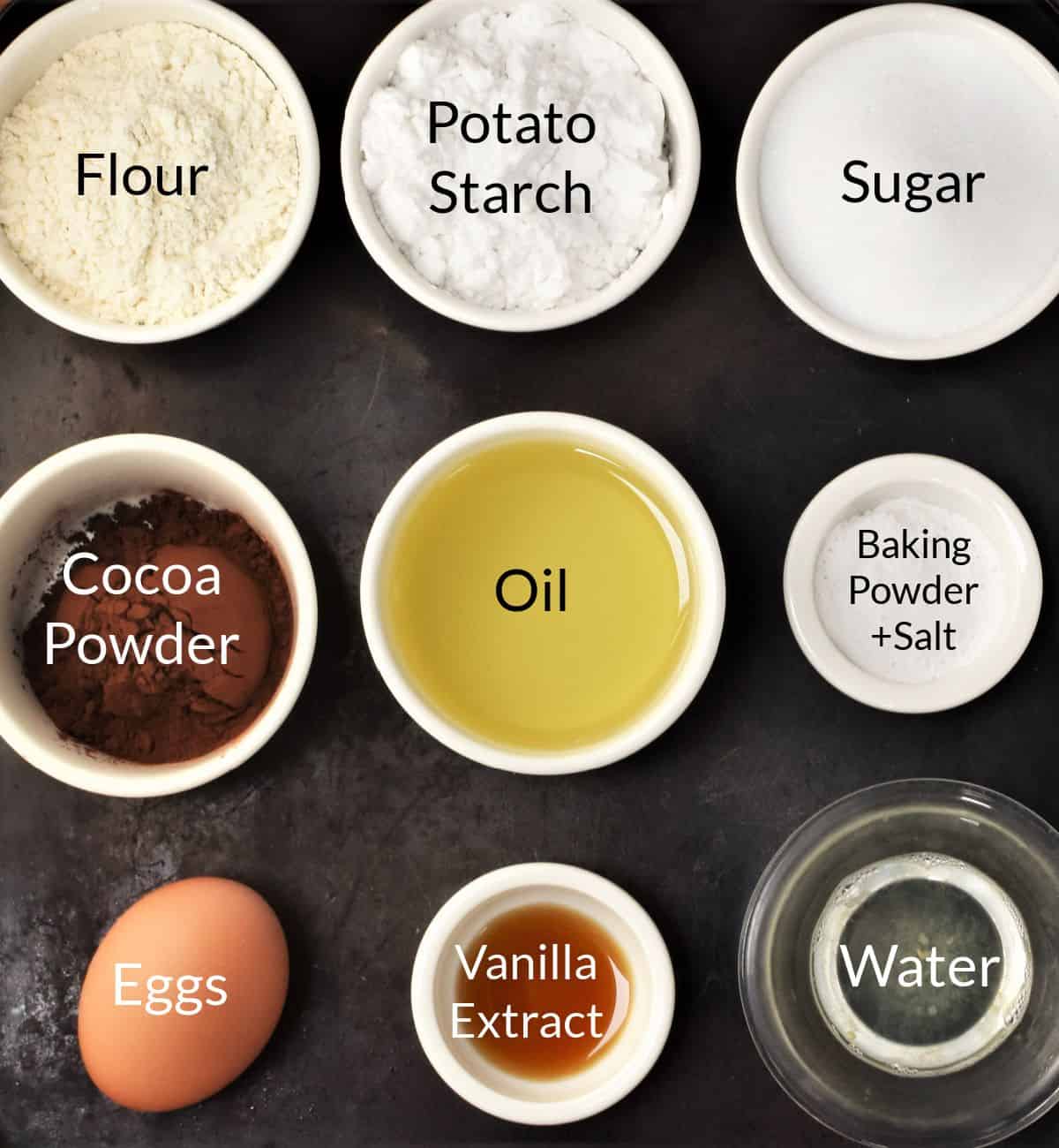 Ingredients for making Polish babka cake in individual dishes.