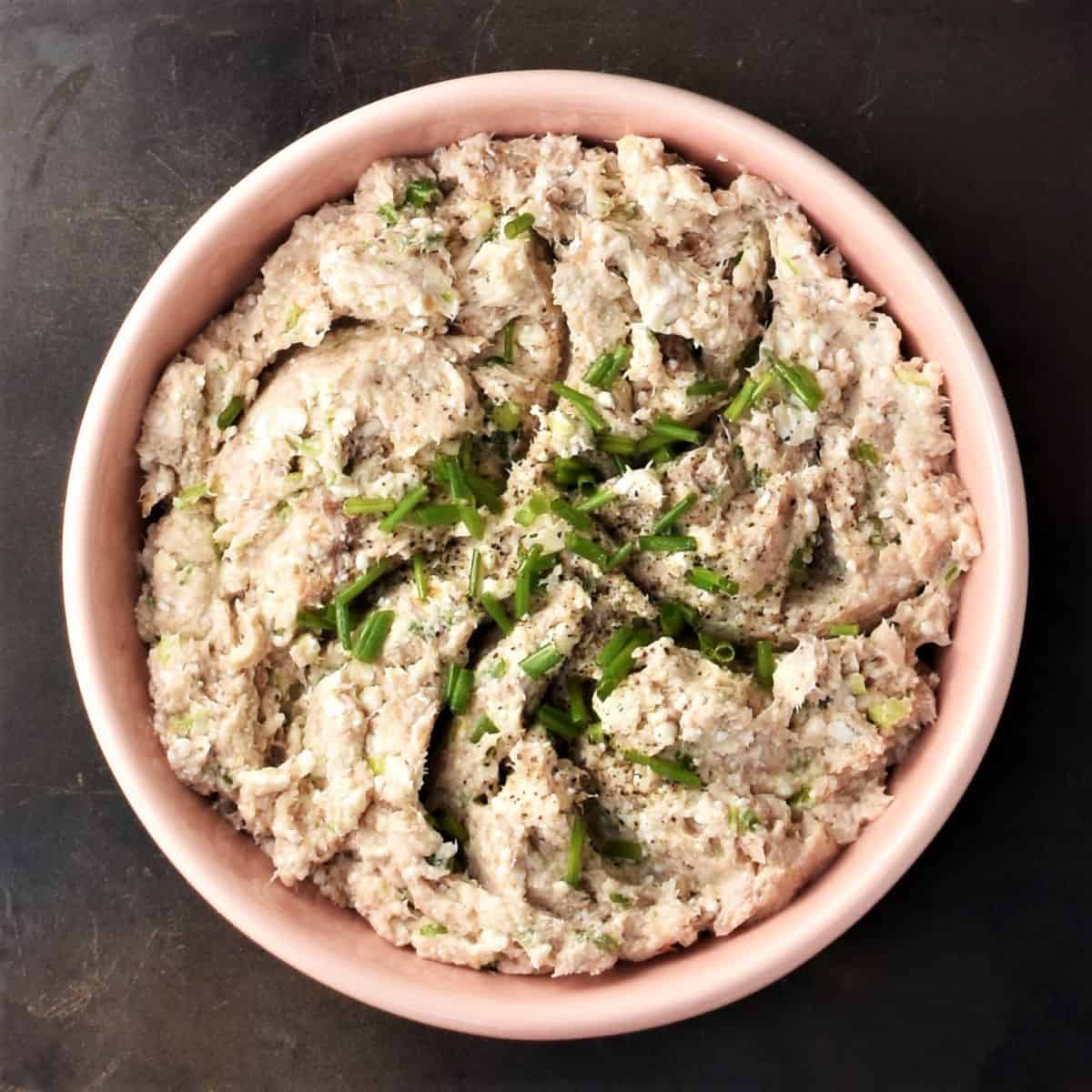Top down view of smoked mackerel pate in pink bowl.