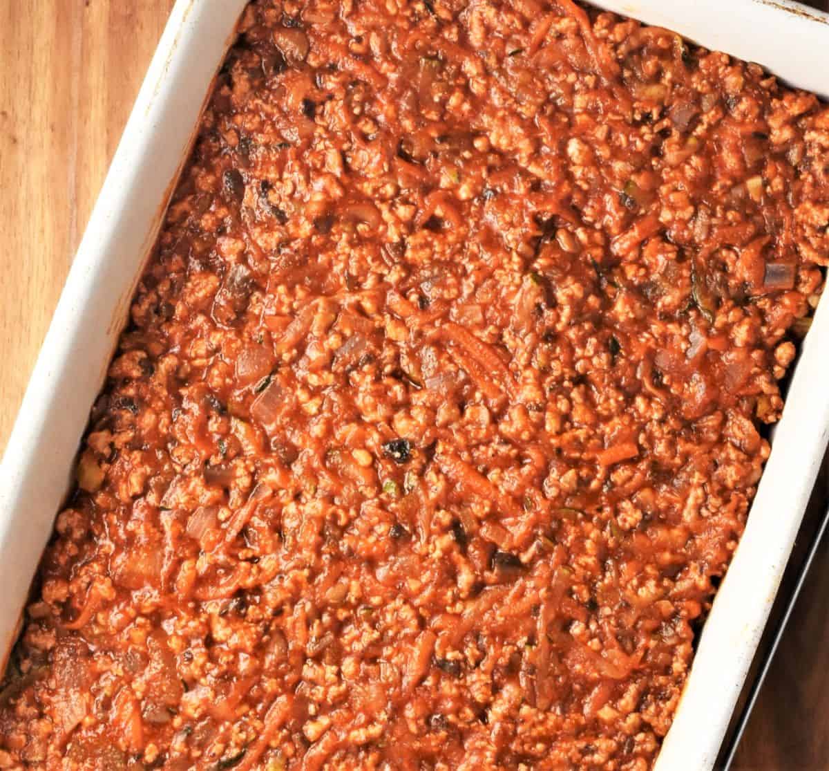 Turkey vegetable lasagna filling mixture in dish.