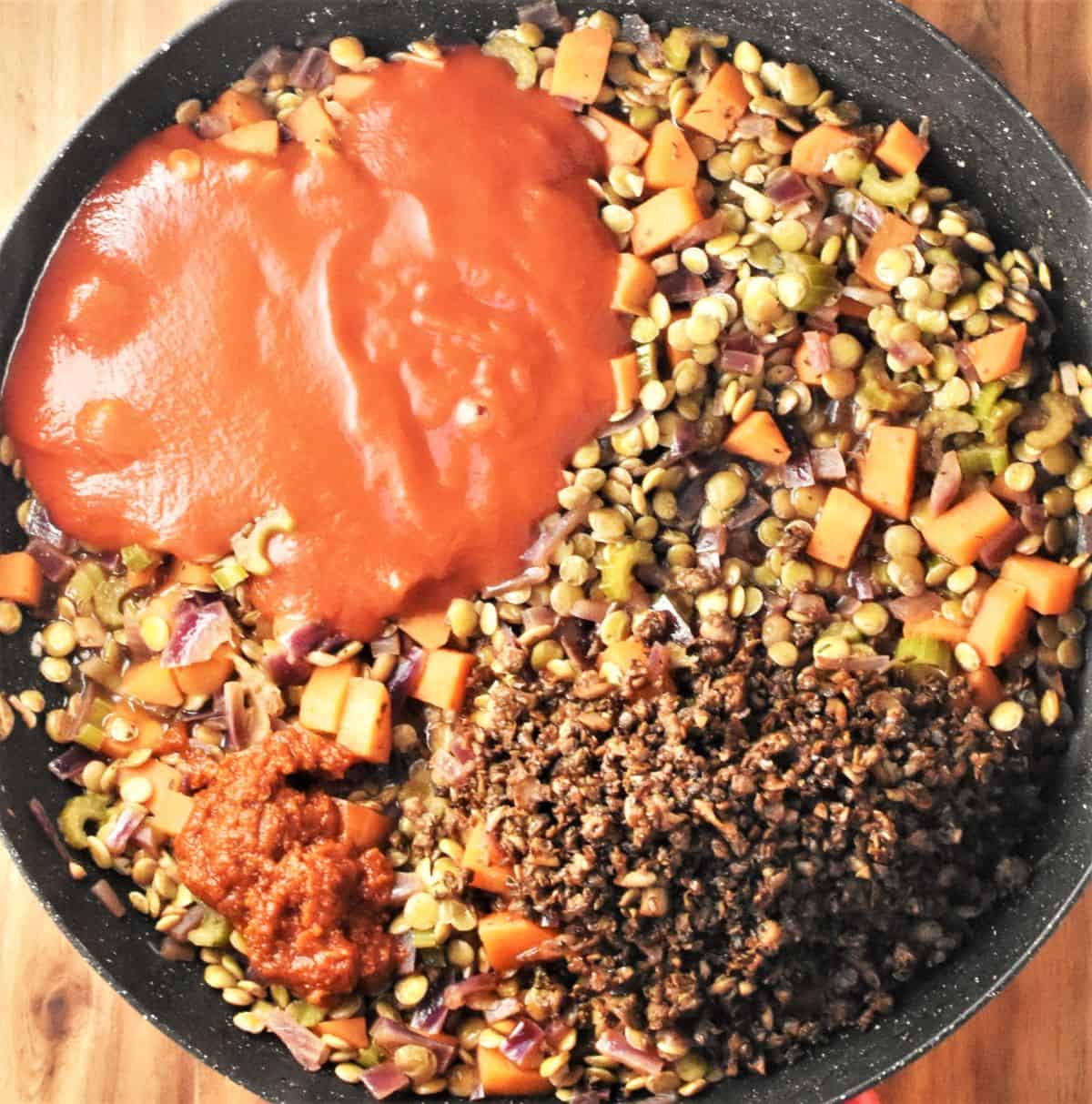 Making ragu sauce with lentils and passata in shallow pan.