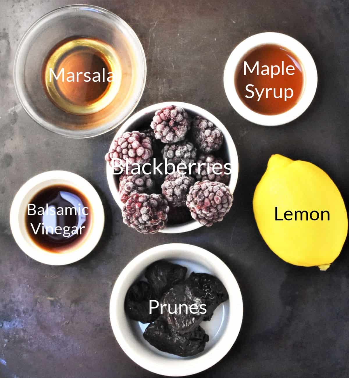 Ingredients for making blackberry coulis in individual dishes.