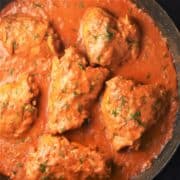 Top down view of creamy Hungarian chicken paprikash in shallow pan.
