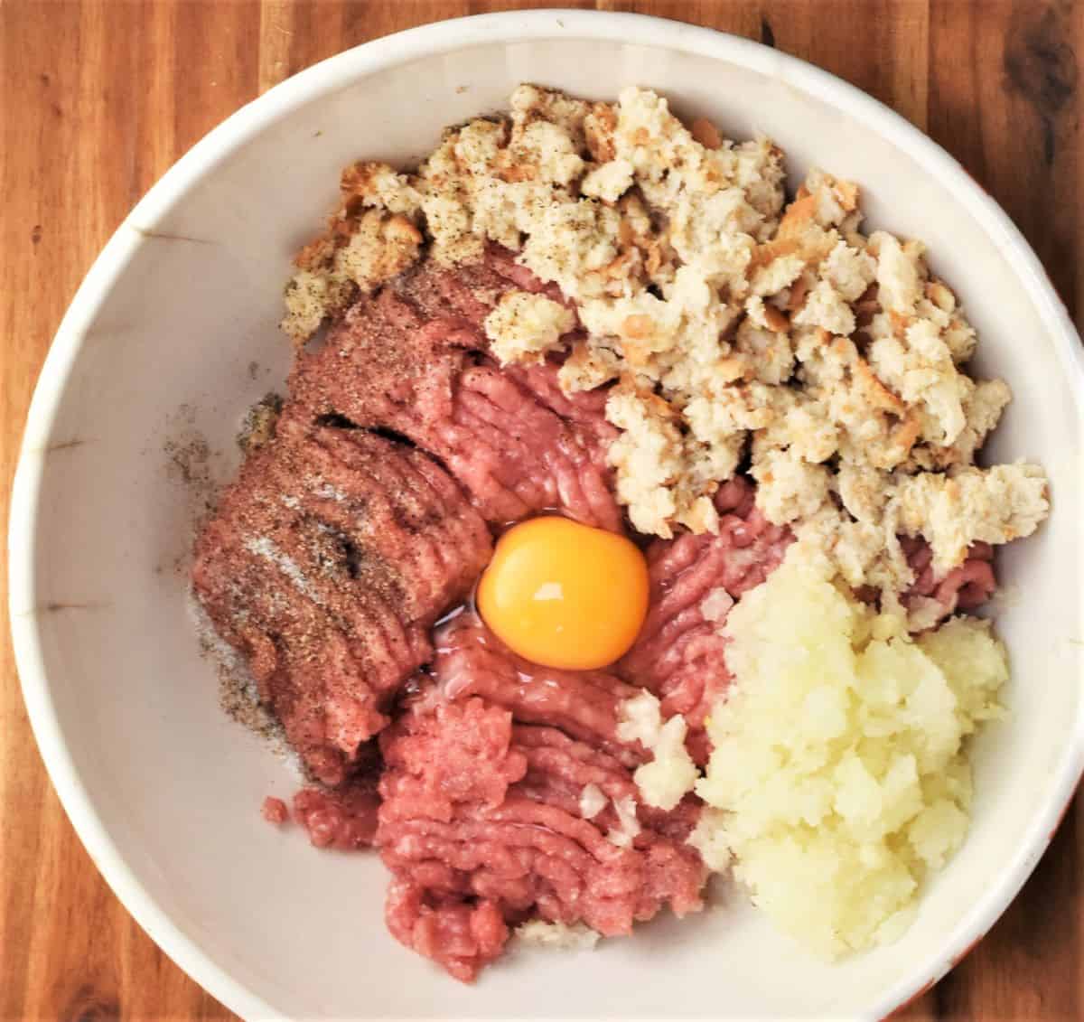 Polish kotlety ingredients in white bowl.