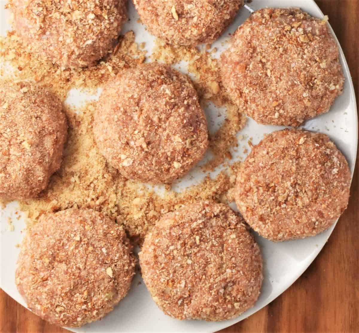 Top down view of breaded kotlety mielone on top of plate.