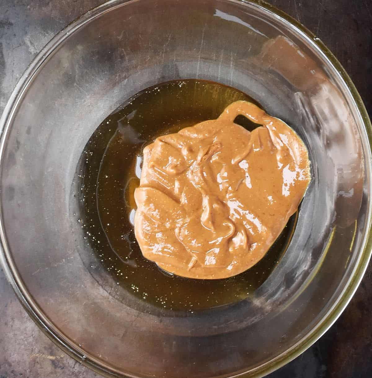 Peanut butter and honey in glass bowl.