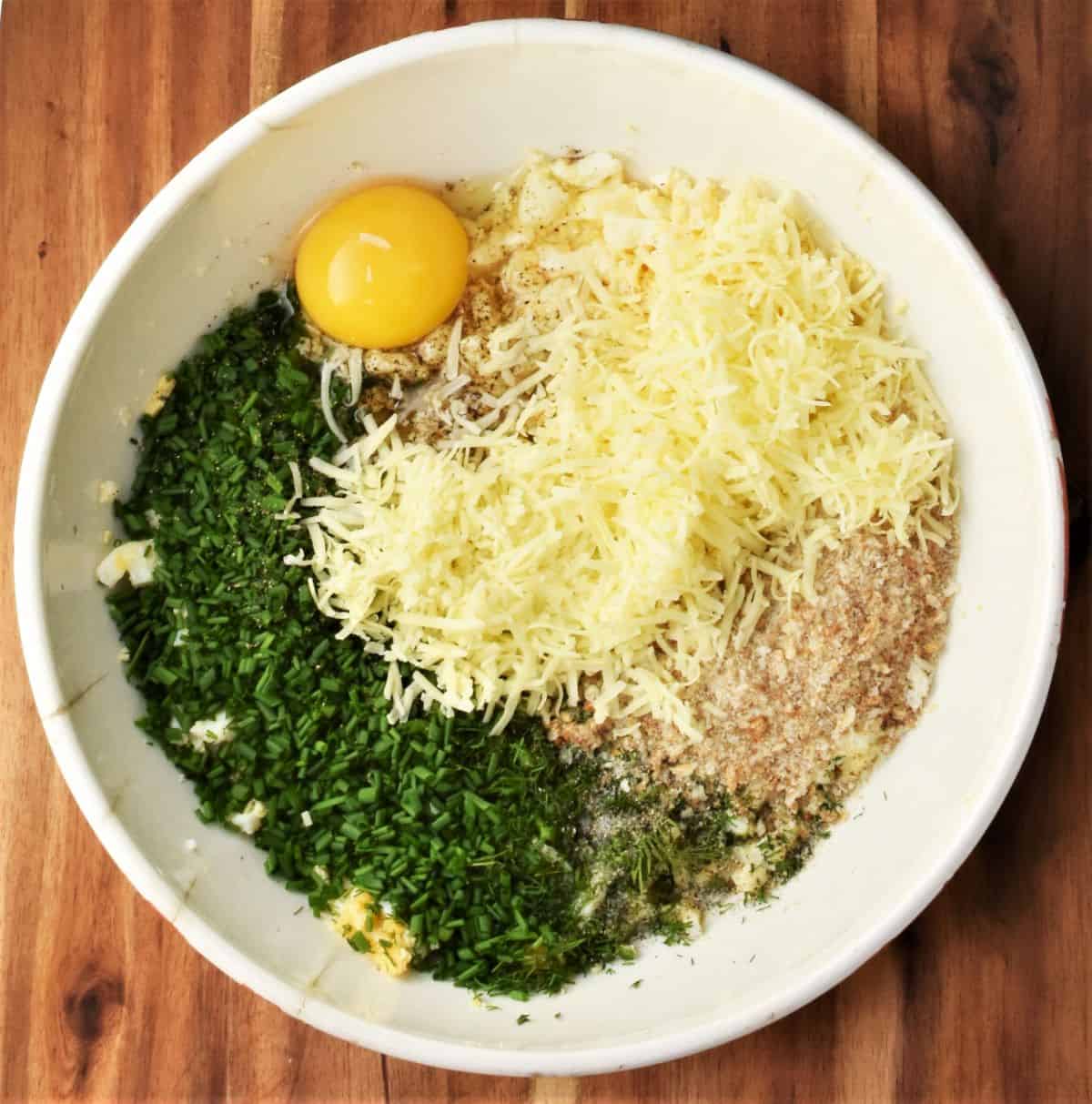 Ingredients for making egg patties in mixing bowl.