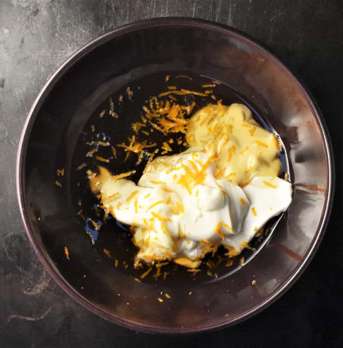 Creamy dressing base ingredients in purple bowl.