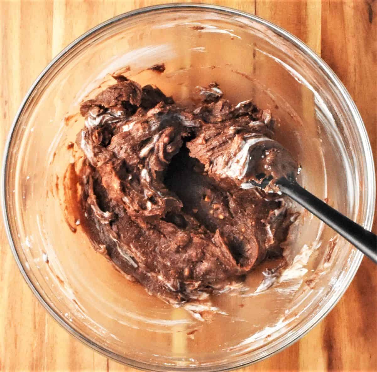 Making peanut butter truffle filling mixture in bowl.