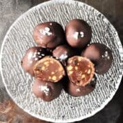 Top down view of peanut butter truffles in crystal bowl.