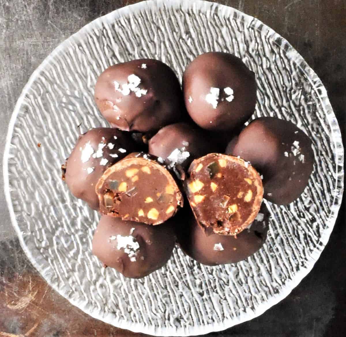 Top down view of peanut butter truffles in crystal bowl.