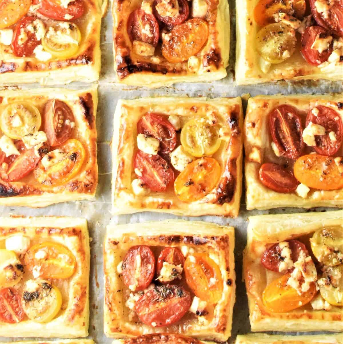 Top down view of 9 baked tomato and feta tartlets.