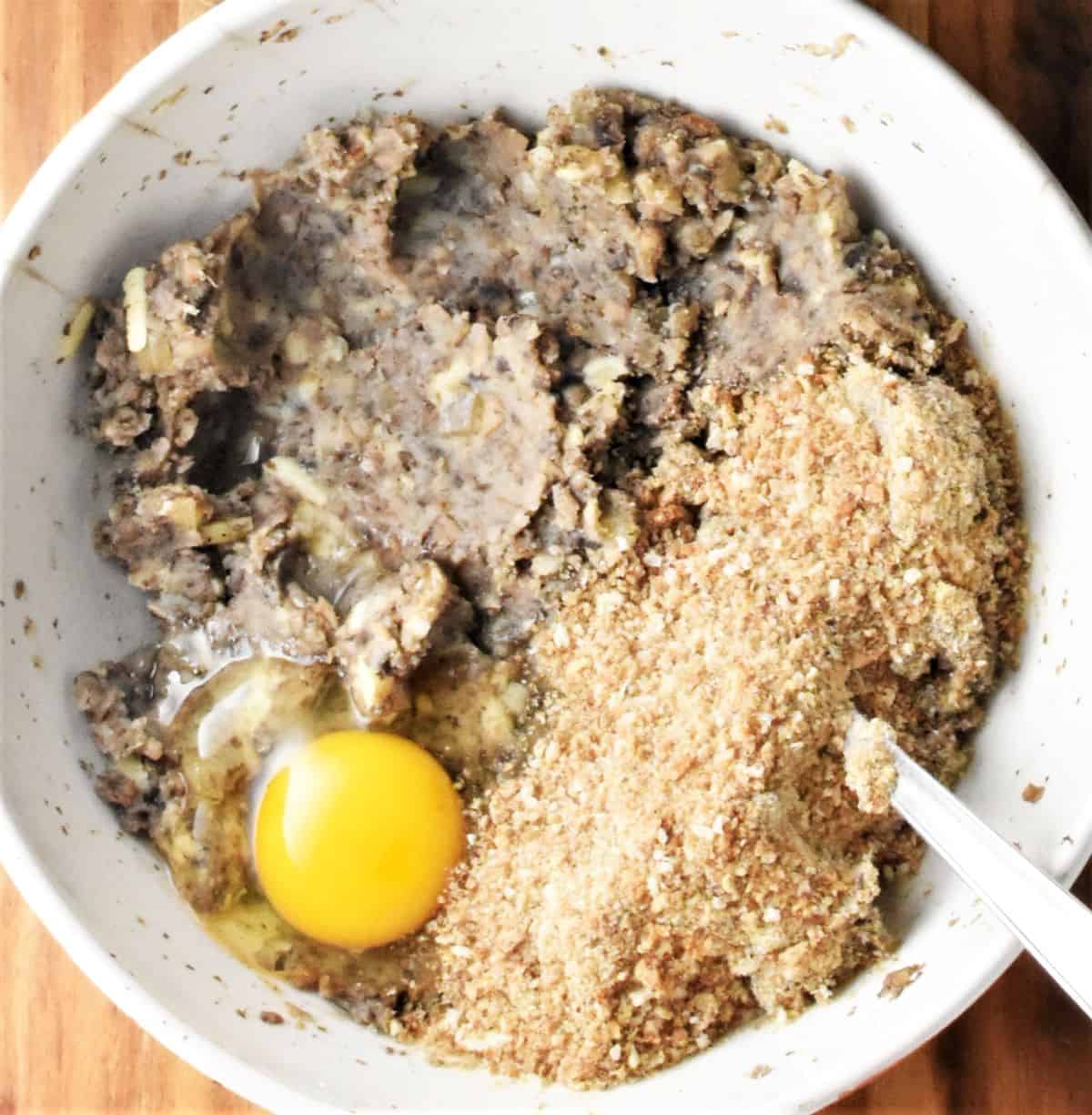 Mushroom croquettes filling with egg and breadcrumbs.