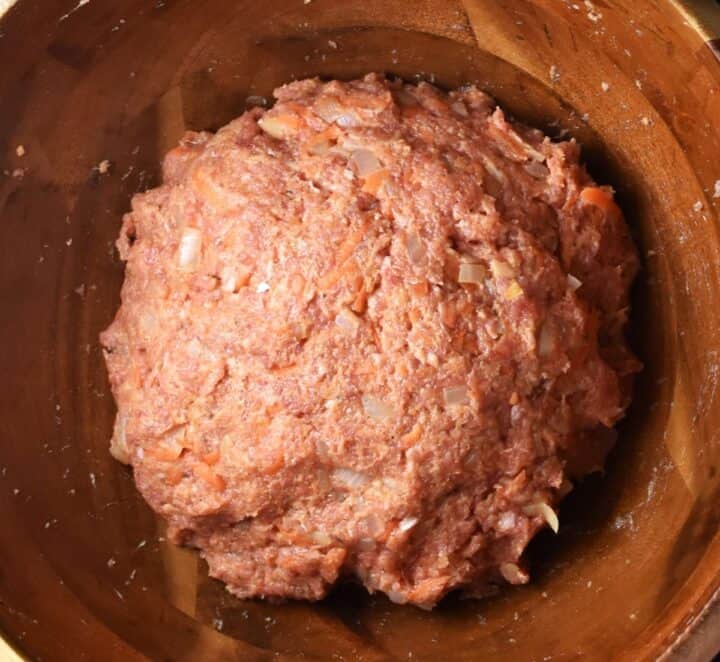 Turkey cabbage roll stuffing mixture in wooden bowl.