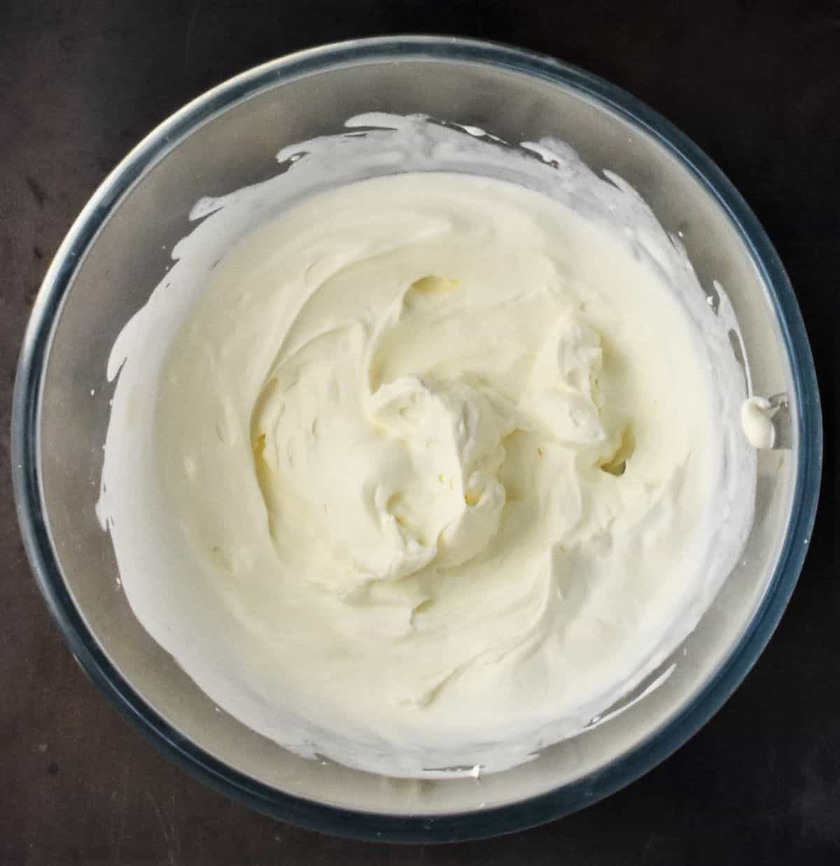 Whipped cream in bowl.