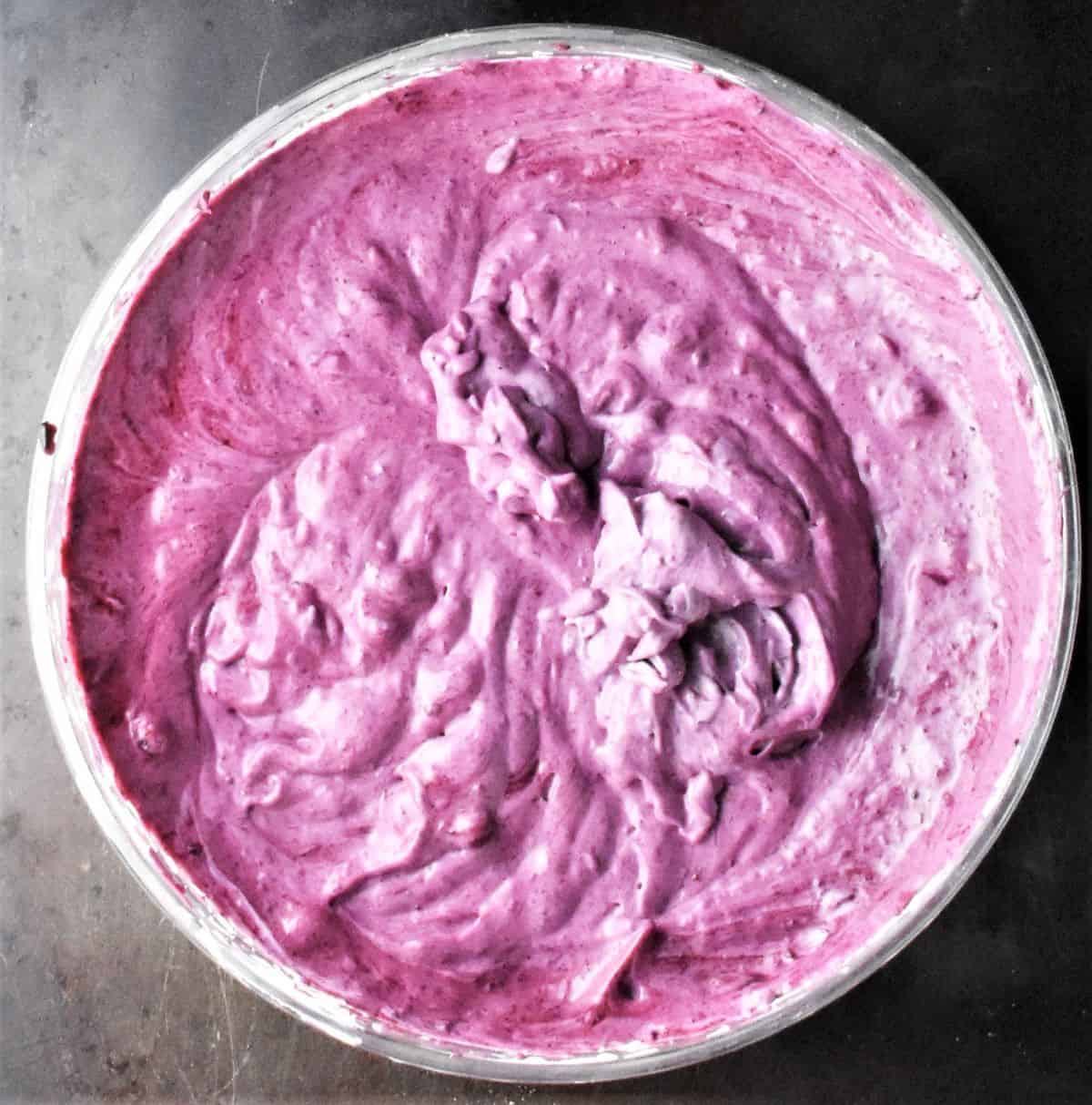 Purple coloured creamy batter in bowl.