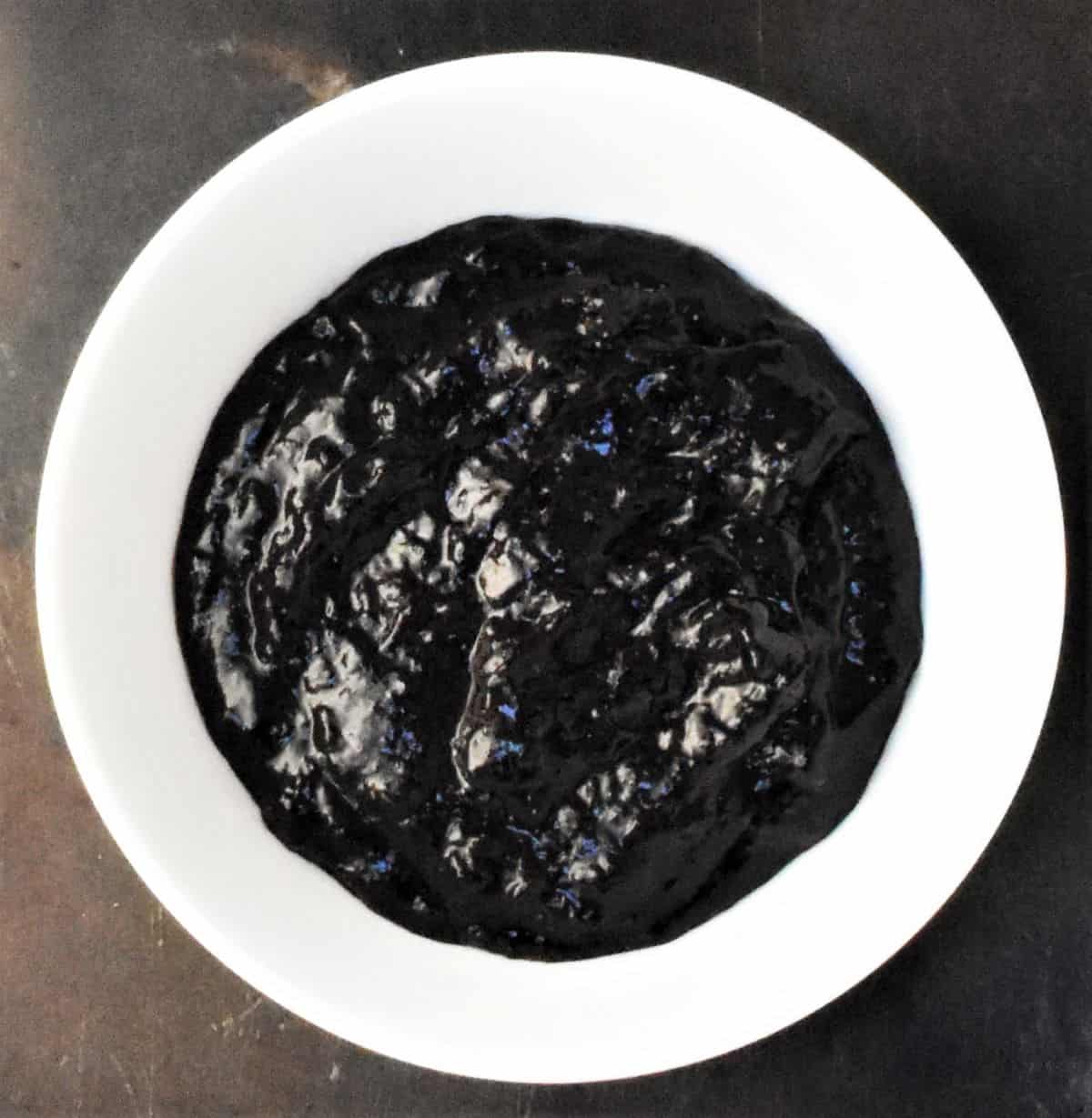 Thick blueberry mixture in white bowl.