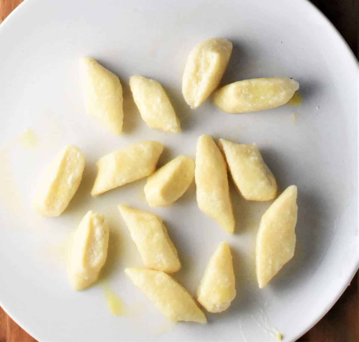 Just boiled lazy pierogies on top of large plate.