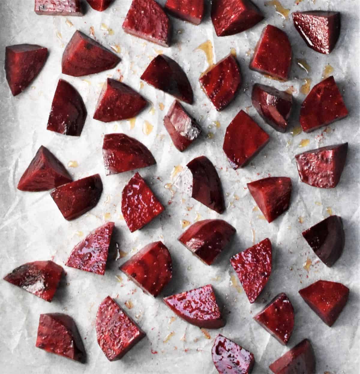 Beet wedges on top of parchment.