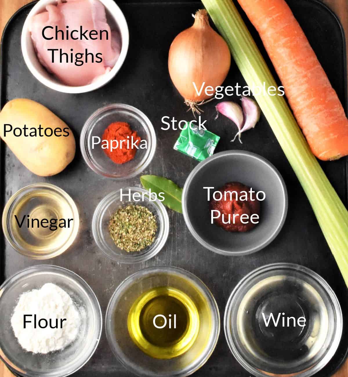 Ingredients for making chicken and potato stew in individual dishes.