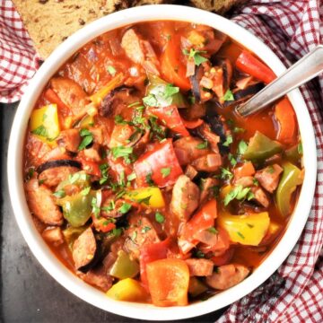 Top down view of Polish letcho in bolw with spoon.