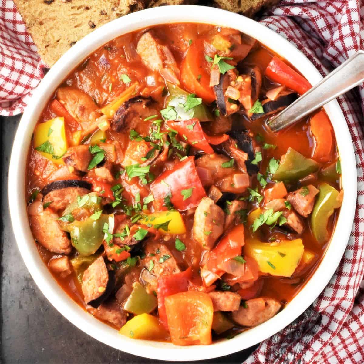 Top down view of Polish letcho in bolw with spoon.