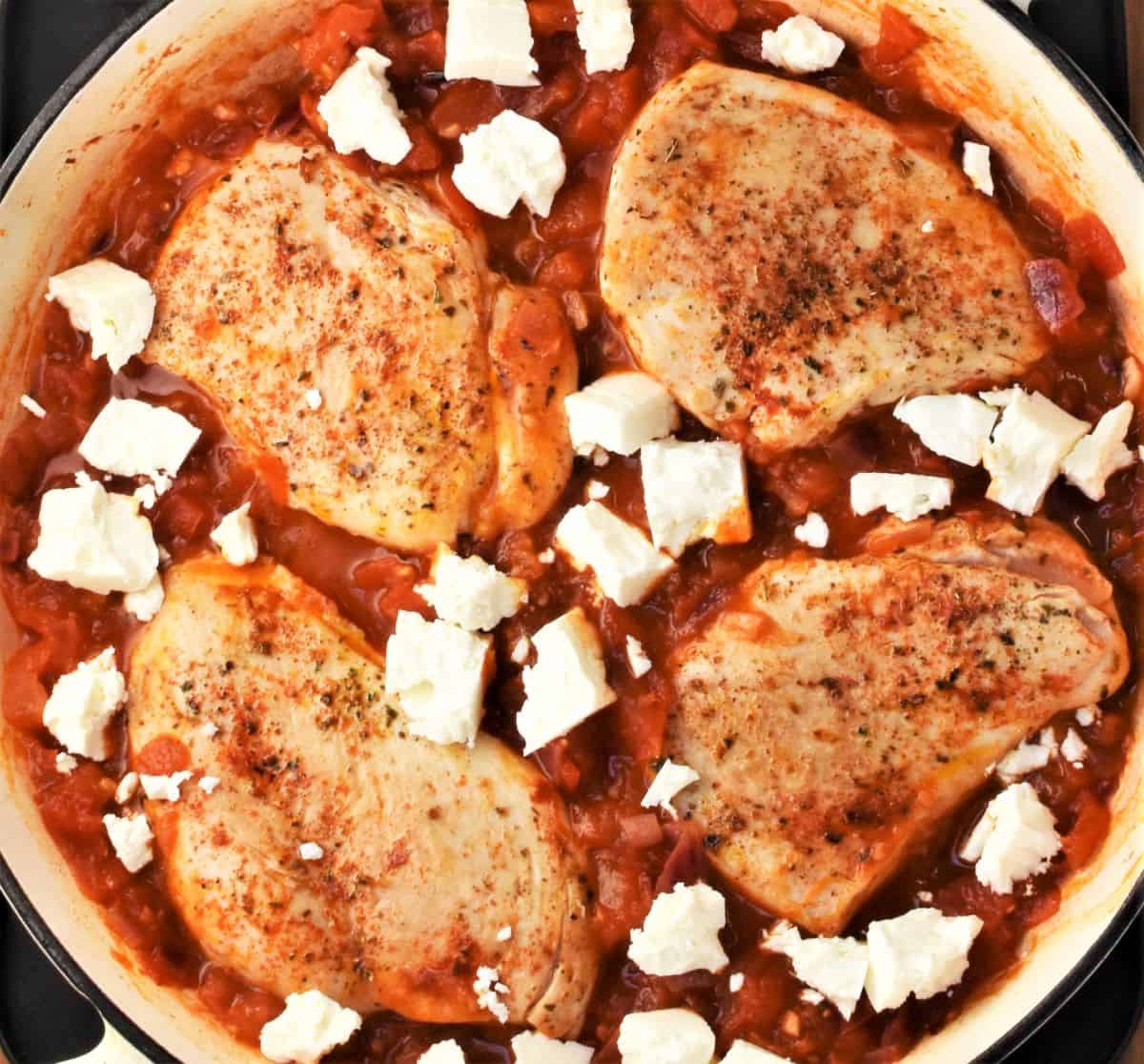 4 skinless chicken breasts in tomato sauce with crumbled feta.